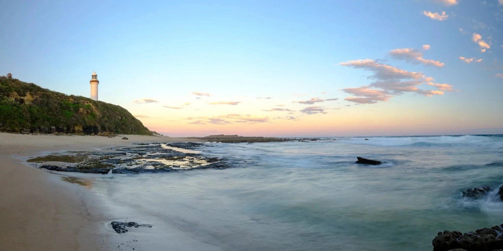 Norah Head Lighthouse at sunrise overlooking the ocean on the Central Coast NSW